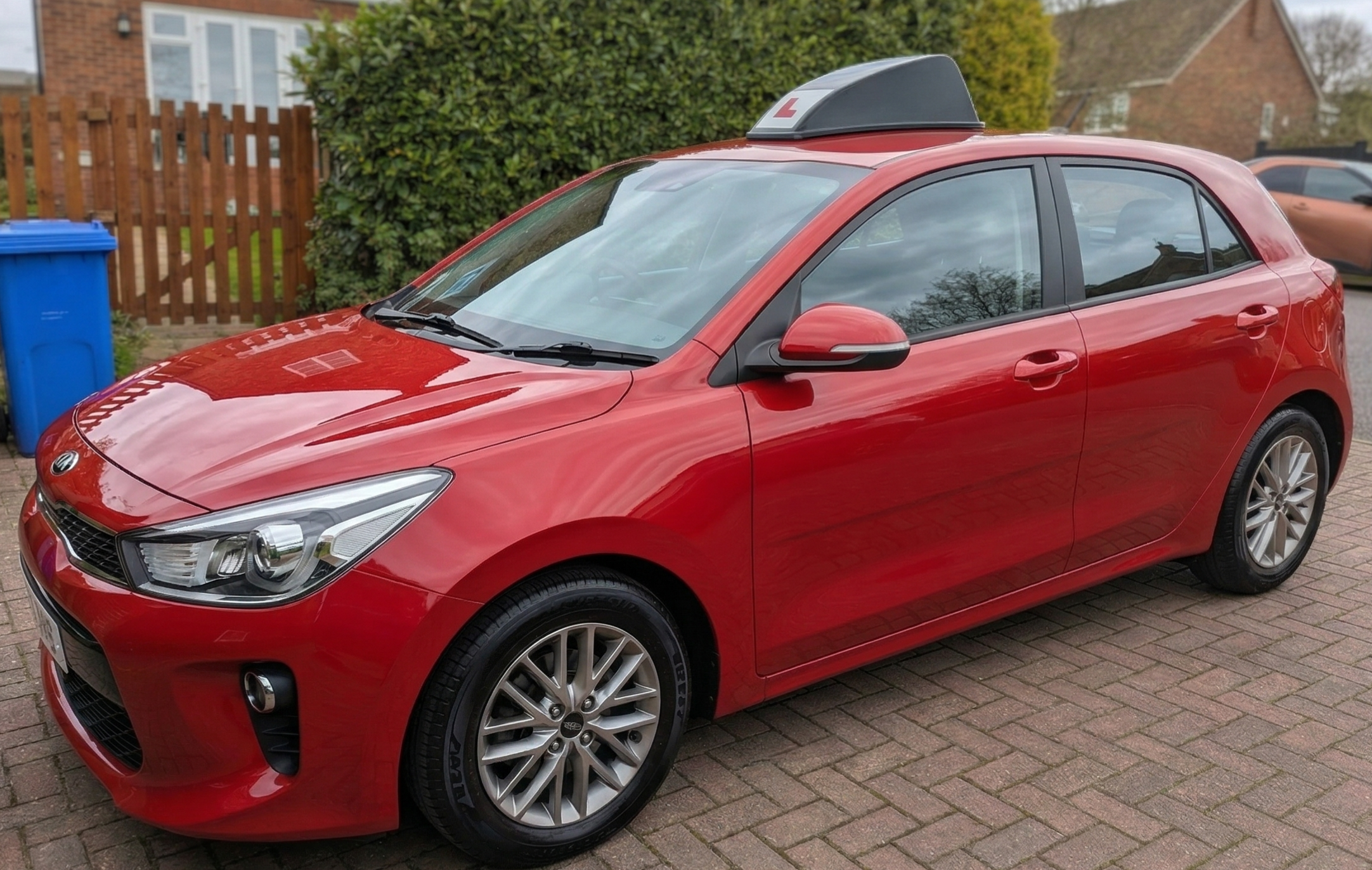 Jamie Almond's teaching car — clean, modern, air-conditioned Kia